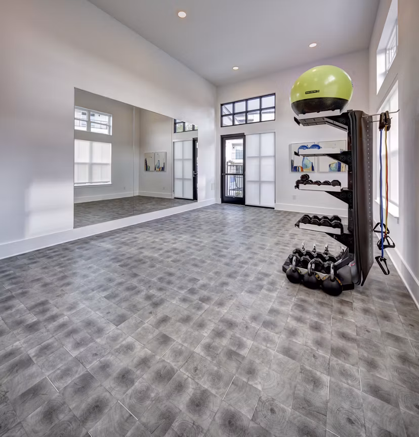State-of-the-art fitness center equipped with modern machines at Leander Park Apartments, ideal for resident workouts and wellness