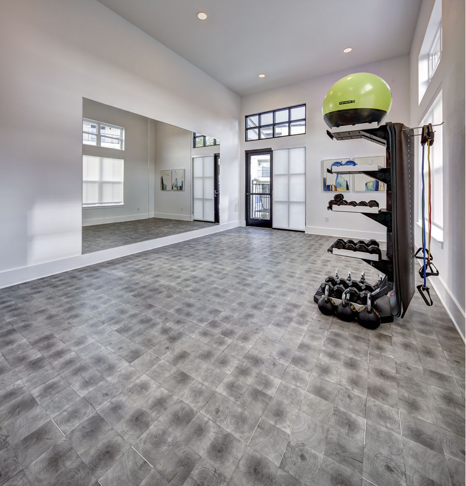 State-of-the-art fitness center equipped with modern machines at Leander Park Apartments, ideal for resident workouts and wellness