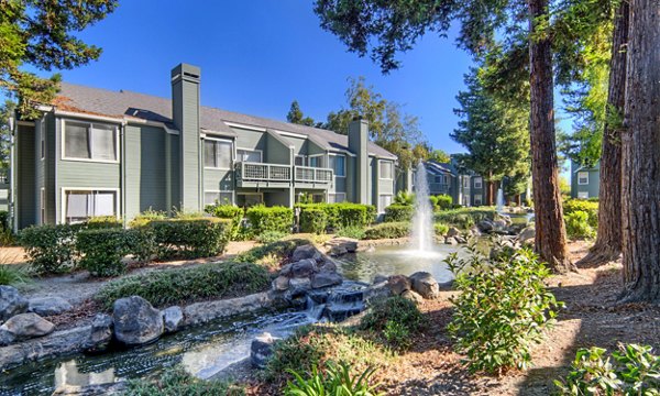 Wood Creek Apartments: Elegant of luxury apartment building with modern design and landscaped surroundings
