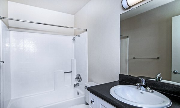 Bathroom with modern fixtures and sleek design at Wood Creek Apartments