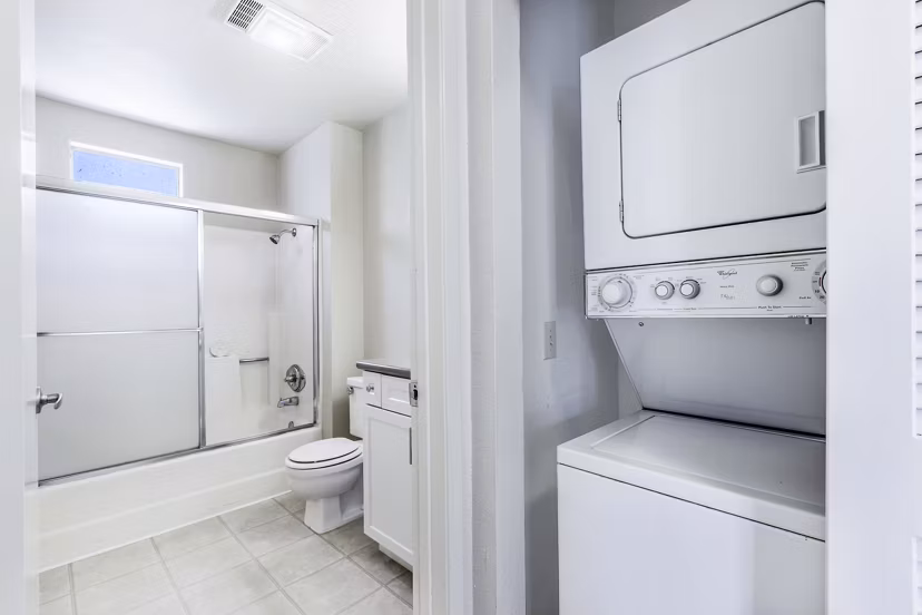 Bathroom and laundry featuring modern fixtures and washer/dryer at Wood Creek Apartments