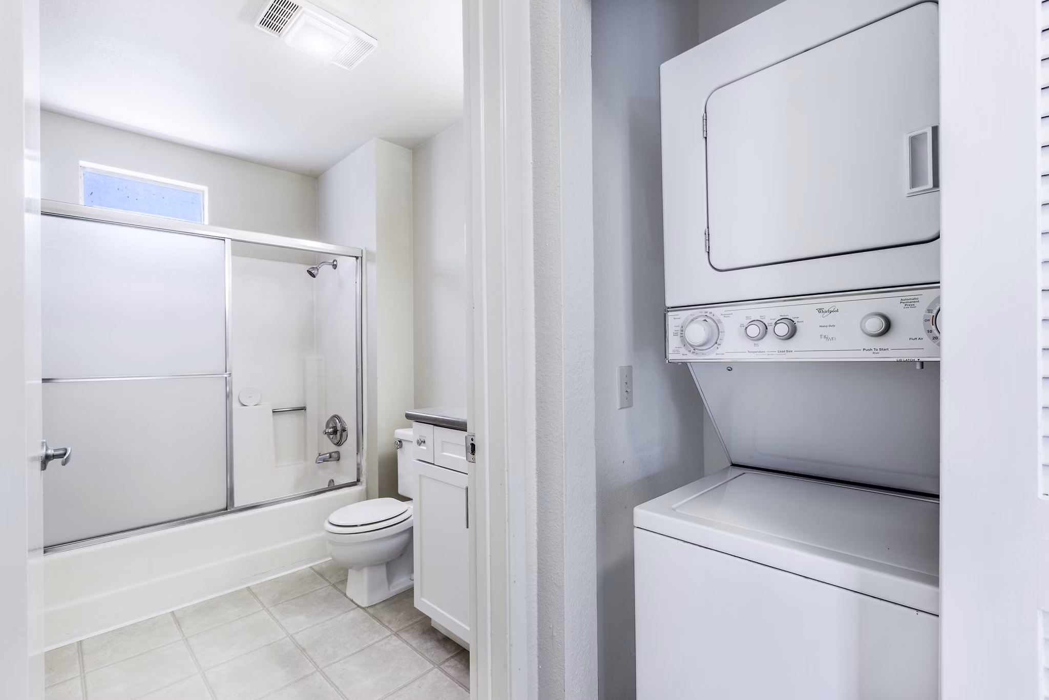 Bathroom and laundry featuring modern fixtures and washer/dryer at Wood Creek Apartments