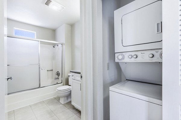 Bathroom and laundry featuring modern fixtures and washer/dryer at Wood Creek Apartments