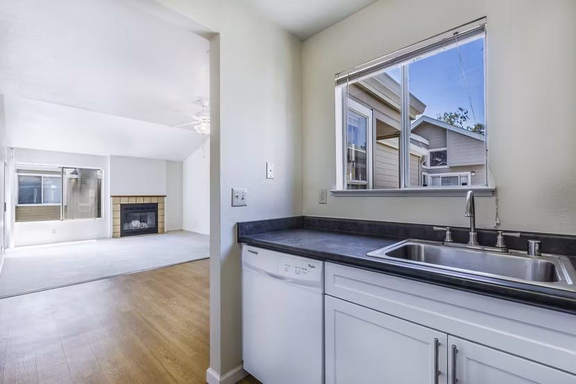 Modern kitchen with stainless steel appliances at Wood Creek Apartments, a Greystar luxury community