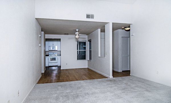 Spacious living room featuring modern decor and ample natural light at Wood Creek Apartments