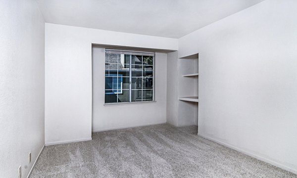Spacious living room with modern decor at Wood Creek Apartments, Greystar luxury living