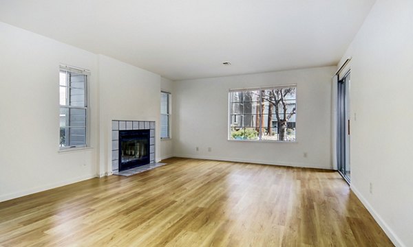 Living room featuring modern decor and open floor plan at Wood Creek Apartments