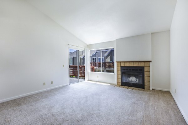 Spacious living room with modern furnishings at Wood Creek Apartments