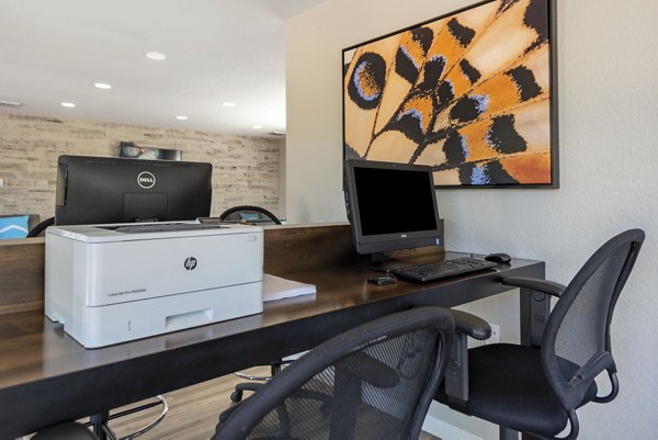Vue at Spring Creek: Modern business center with ergonomic seating and high-speed Wi-Fi in luxury apartments