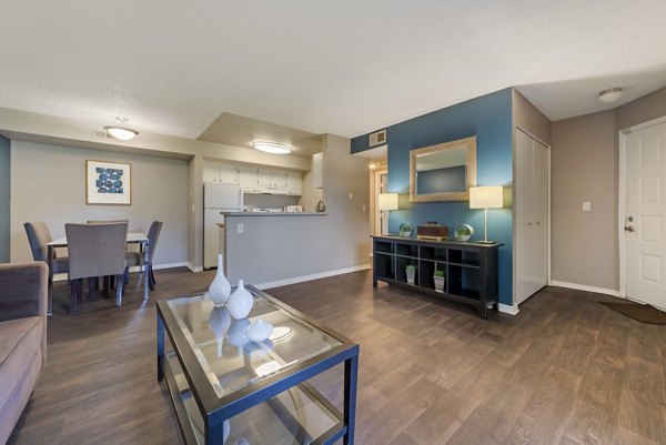 Vue at Spring Creek: Modern living room with cozy seating and natural light