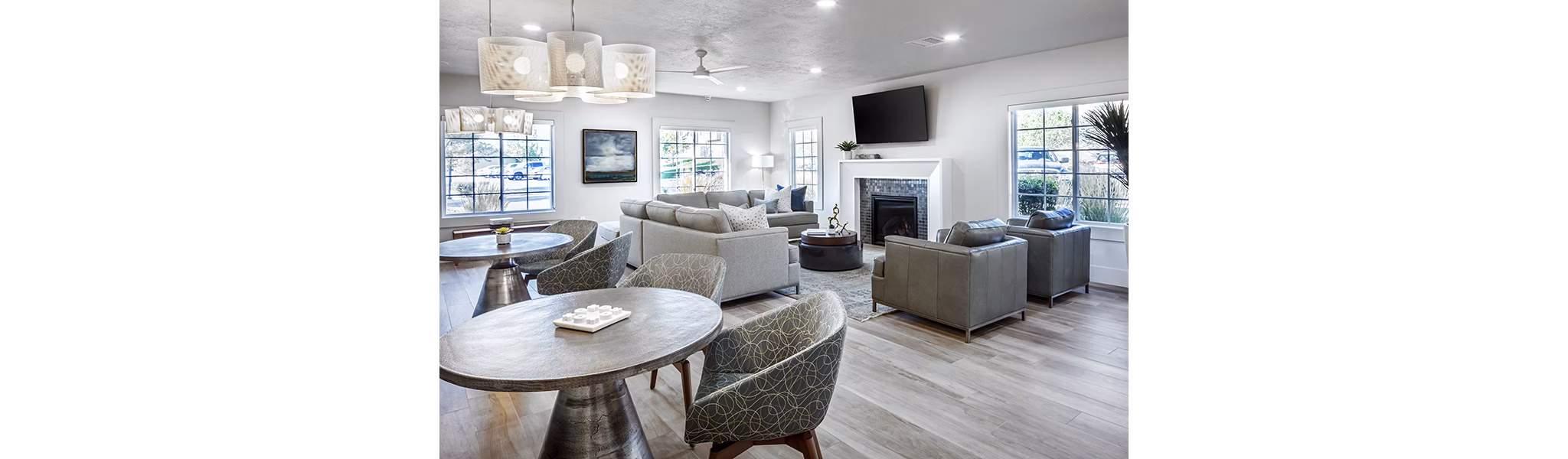 Elegant clubhouse with modern seating and fireplace at Monarch Meadows Apartments, ideal for social gatherings and relaxation