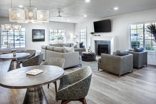 Elegant clubhouse with modern seating and fireplace at Monarch Meadows Apartments, ideal for social gatherings and relaxation