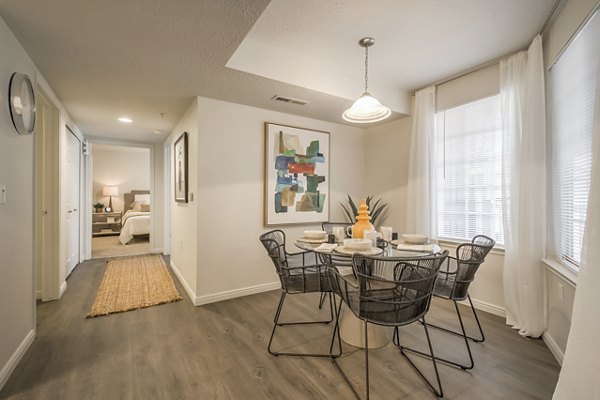 Dining area featuring modern furnishings and elegant lighting at Monarch Meadows Apartments