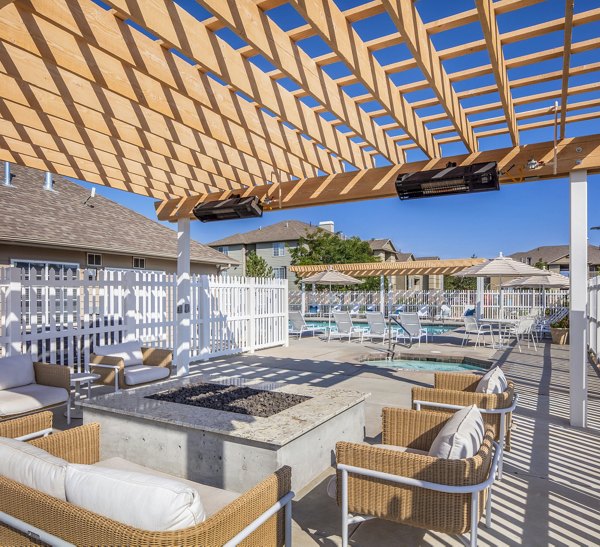 Cozy fire pit area on the patio at Monarch Meadows Apartments