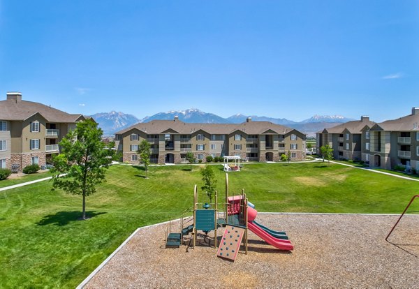 Playground area with mountain views at Monarch Meadows Apartments: Enjoy outdoor fun and scenic vistas at these luxury apartments