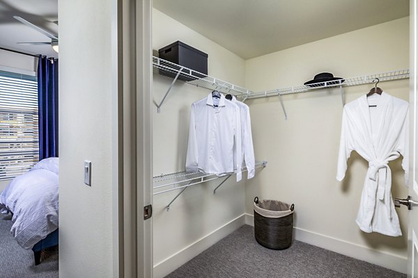 Cozy bedroom with modern furnishings at The Residences at Cota Vera Apartments