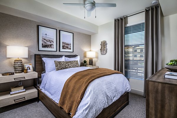 Cozy bedroom with modern decor at The Residences at Cota Vera Apartments