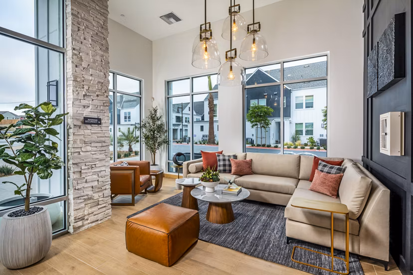 Clubhouse featuring modern design and cozy seating at The Residences at Cota Vera Apartments