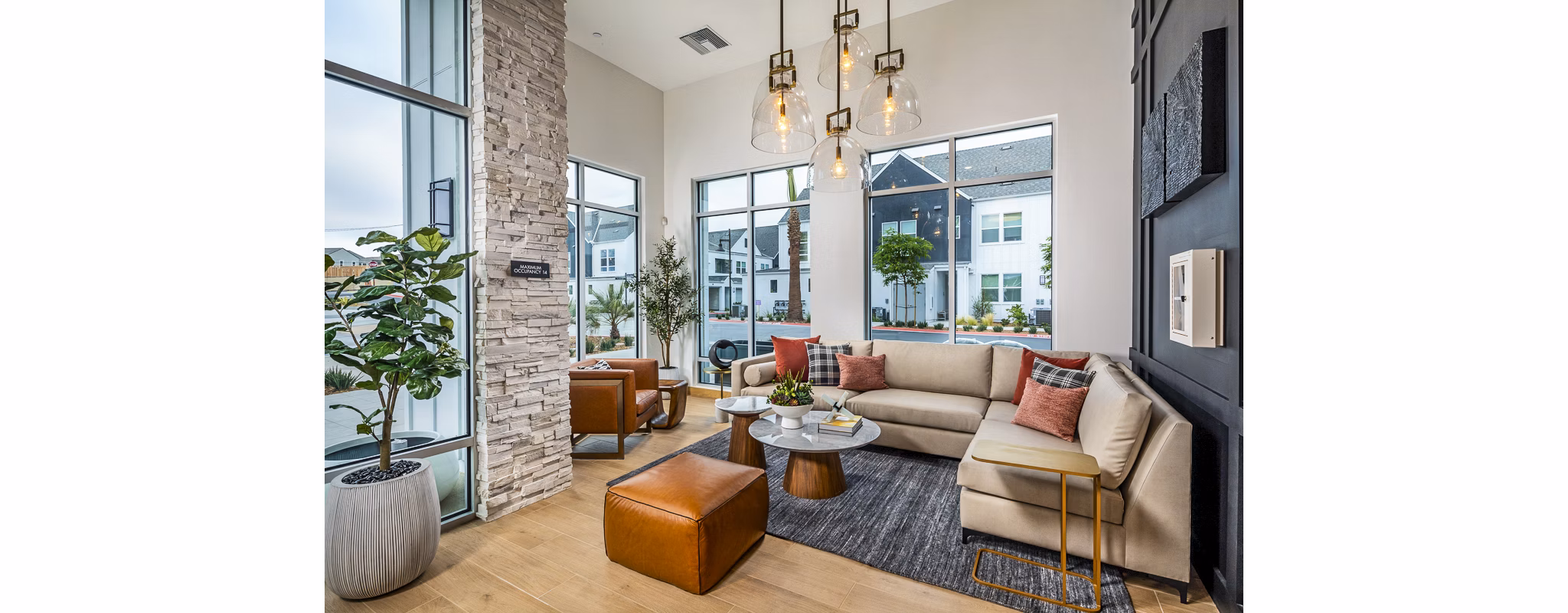 Clubhouse featuring modern design and cozy seating at The Residences at Cota Vera Apartments