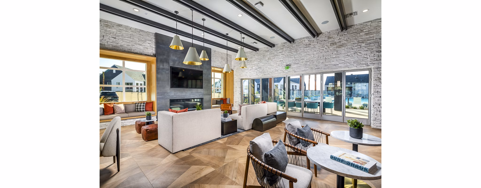 Modern clubhouse with stylish seating and community area at The Residences at Cota Vera Apartments