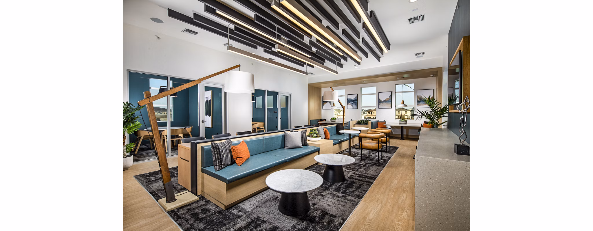 Clubhouse featuring modern design and communal seating at The Residences at Cota Vera Apartments