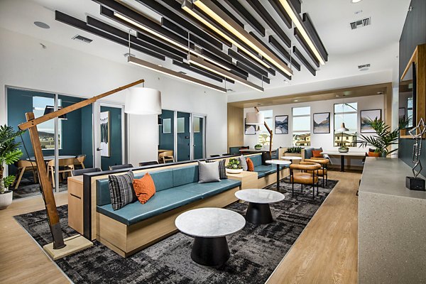 Clubhouse featuring modern design and communal seating at The Residences at Cota Vera Apartments