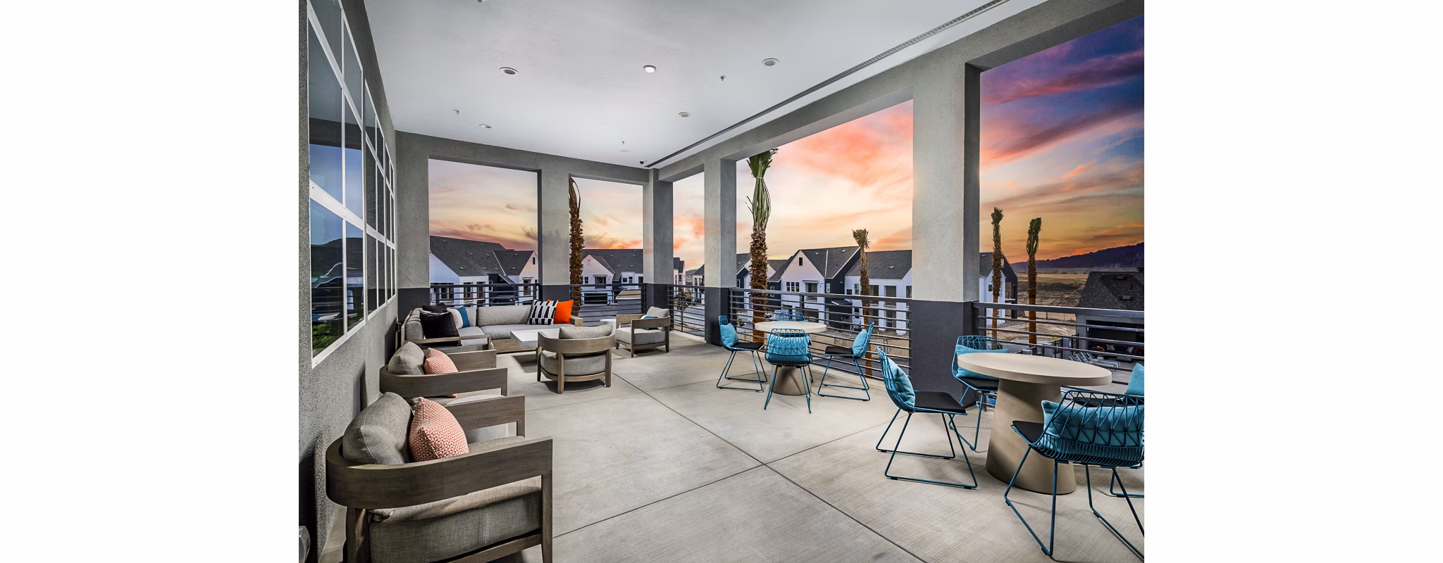 Clubhouse with modern design and seating at The Residences at Cota Vera Apartments
