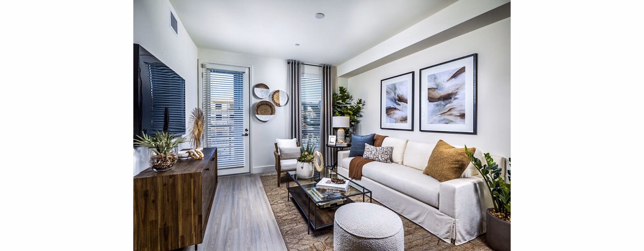 Modern living room with stylish furnishings at The Residences at Cota Vera Apartments