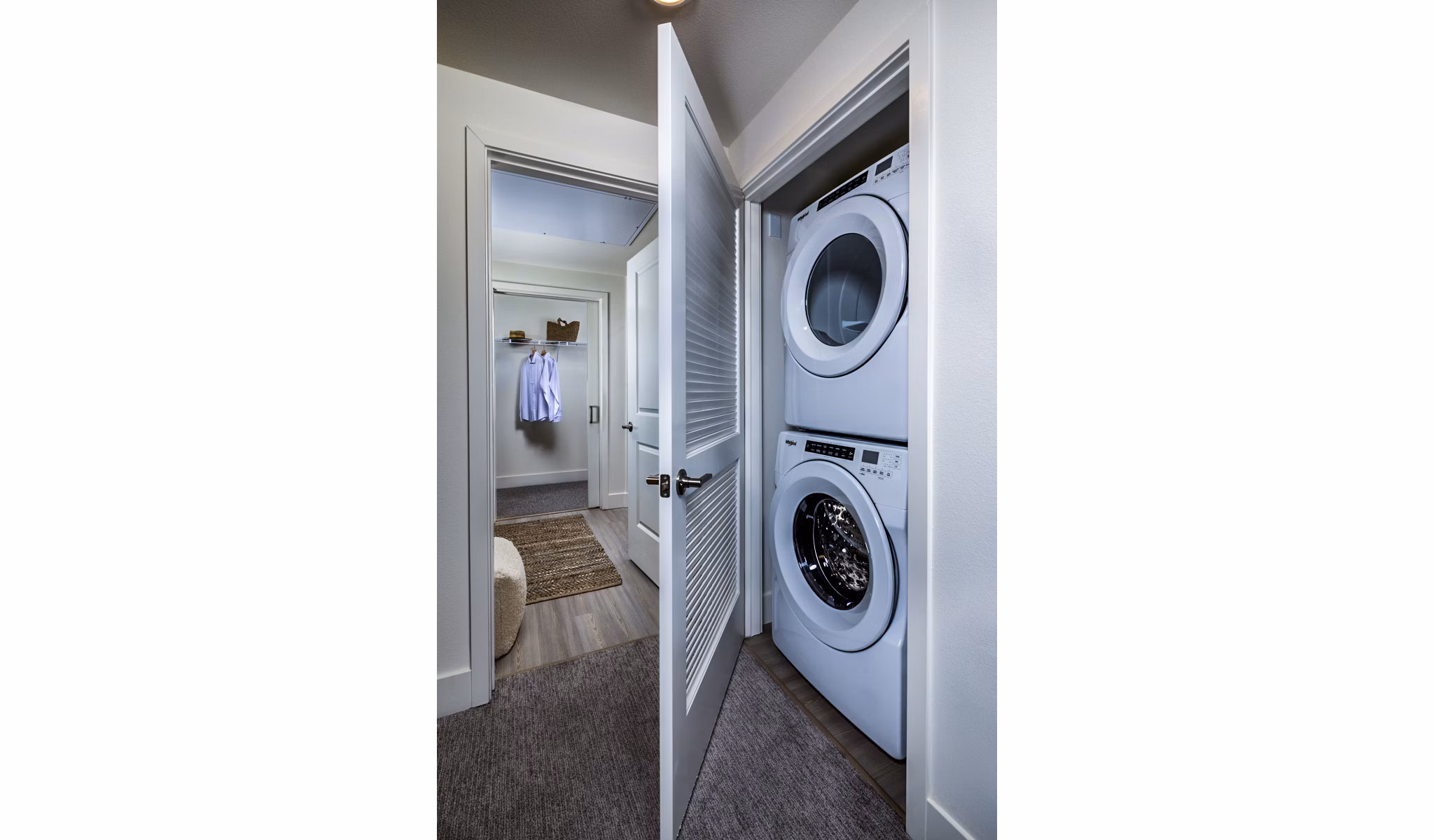 Laundry room at The Residences at Cota Vera, featuring modern appliances and ample storage in a luxury apartment community