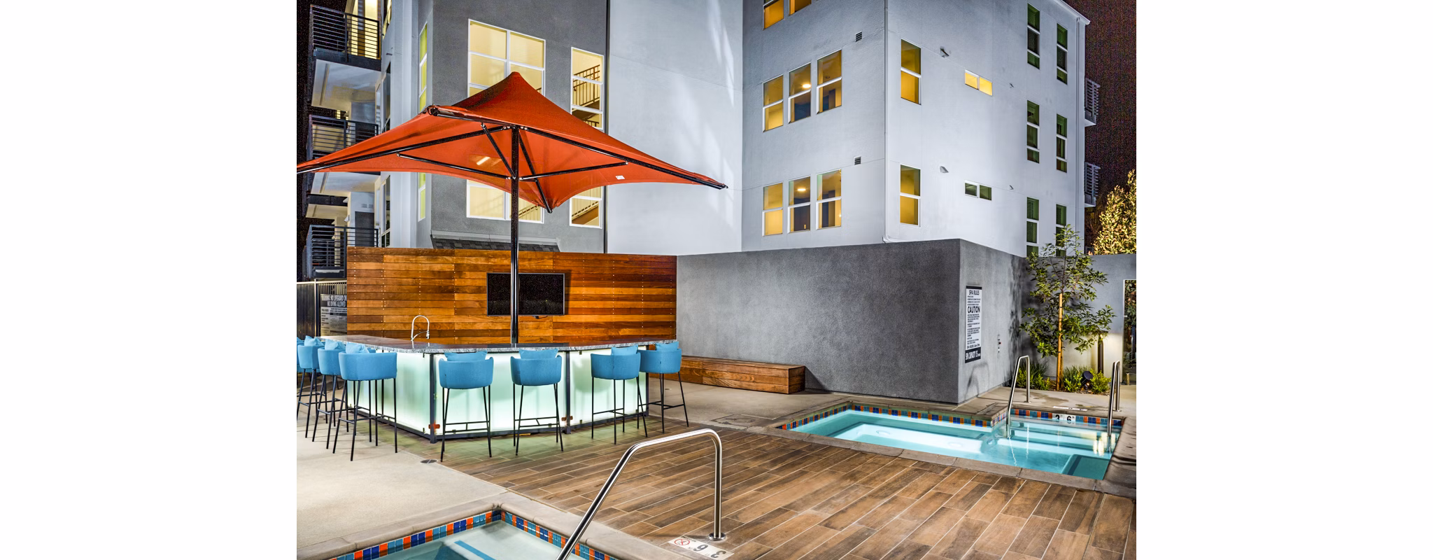 Resort-style pool with lounge chairs at The Residences at Cota Vera Apartments in Chula Vista