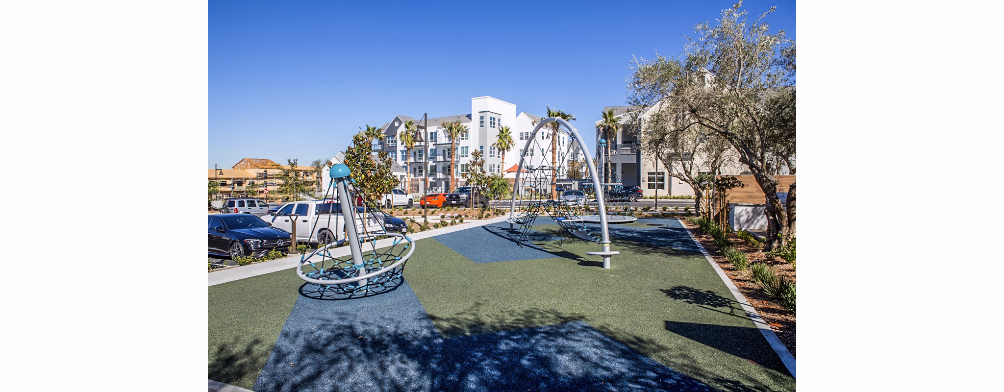 Colorful playground at The Residences at Cota Vera Apartments offering family-friendly recreation