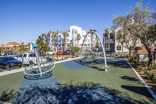 Colorful playground at The Residences at Cota Vera Apartments offering family-friendly recreation