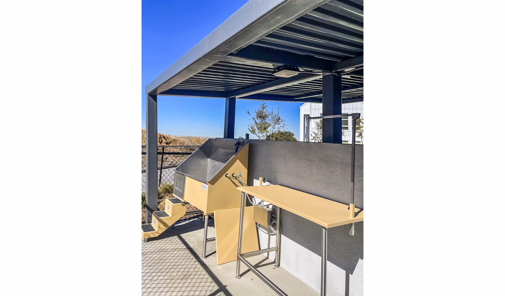 Dog wash station for resident pets at The Residences at Cota Vera Apartments