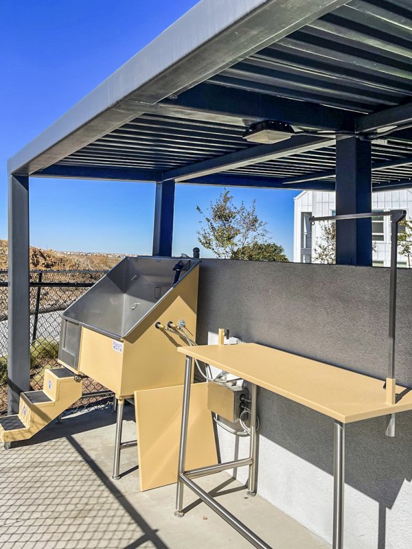 Dog wash station for resident pets at The Residences at Cota Vera Apartments