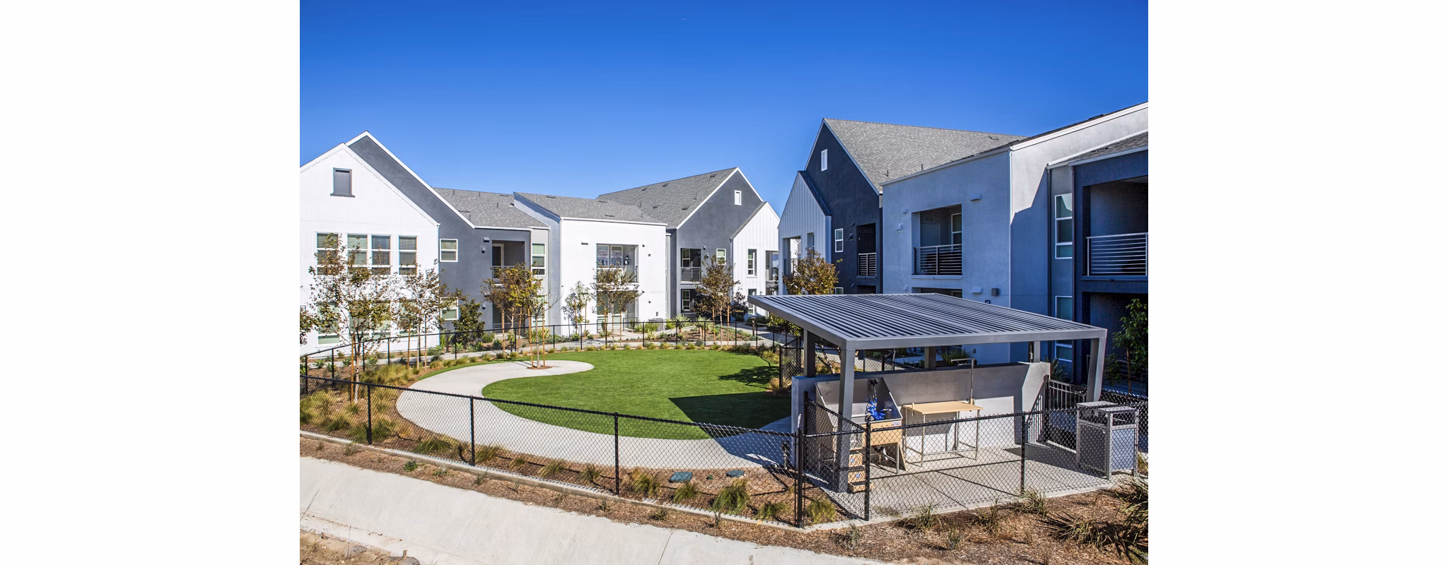 Dog park and wash station at The Residences at Cota Vera Apartments, offering pet-friendly amenities for residents and their furry companions