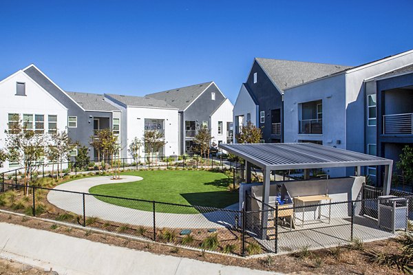 Dog park and wash station at The Residences at Cota Vera Apartments, offering pet-friendly amenities for residents and their furry companions