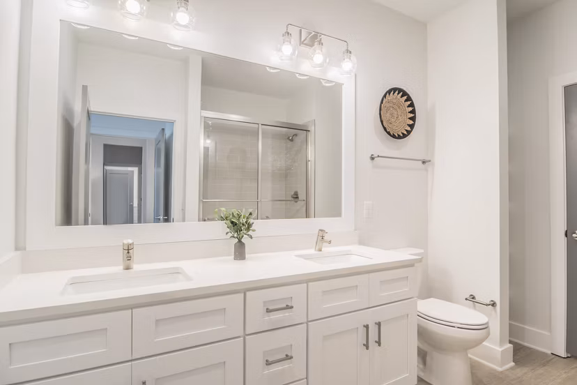 Modern bathroom with sleek fixtures at The Heron luxury apartments, River Island