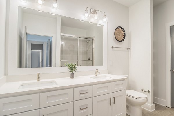 Modern bathroom with sleek fixtures at The Heron luxury apartments, River Island