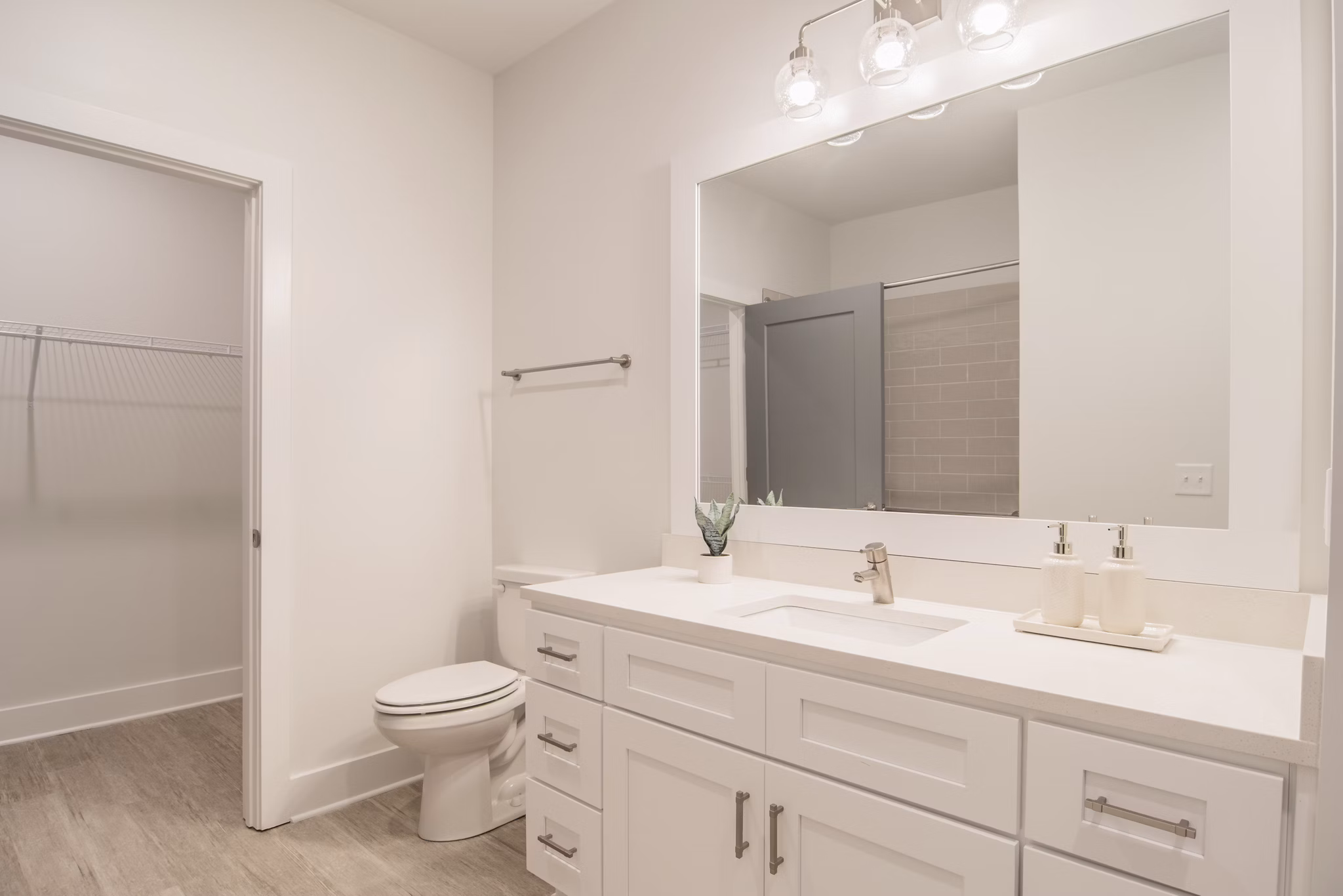 Luxurious bathroom with sleek fixtures at The Heron at River Island Apartments