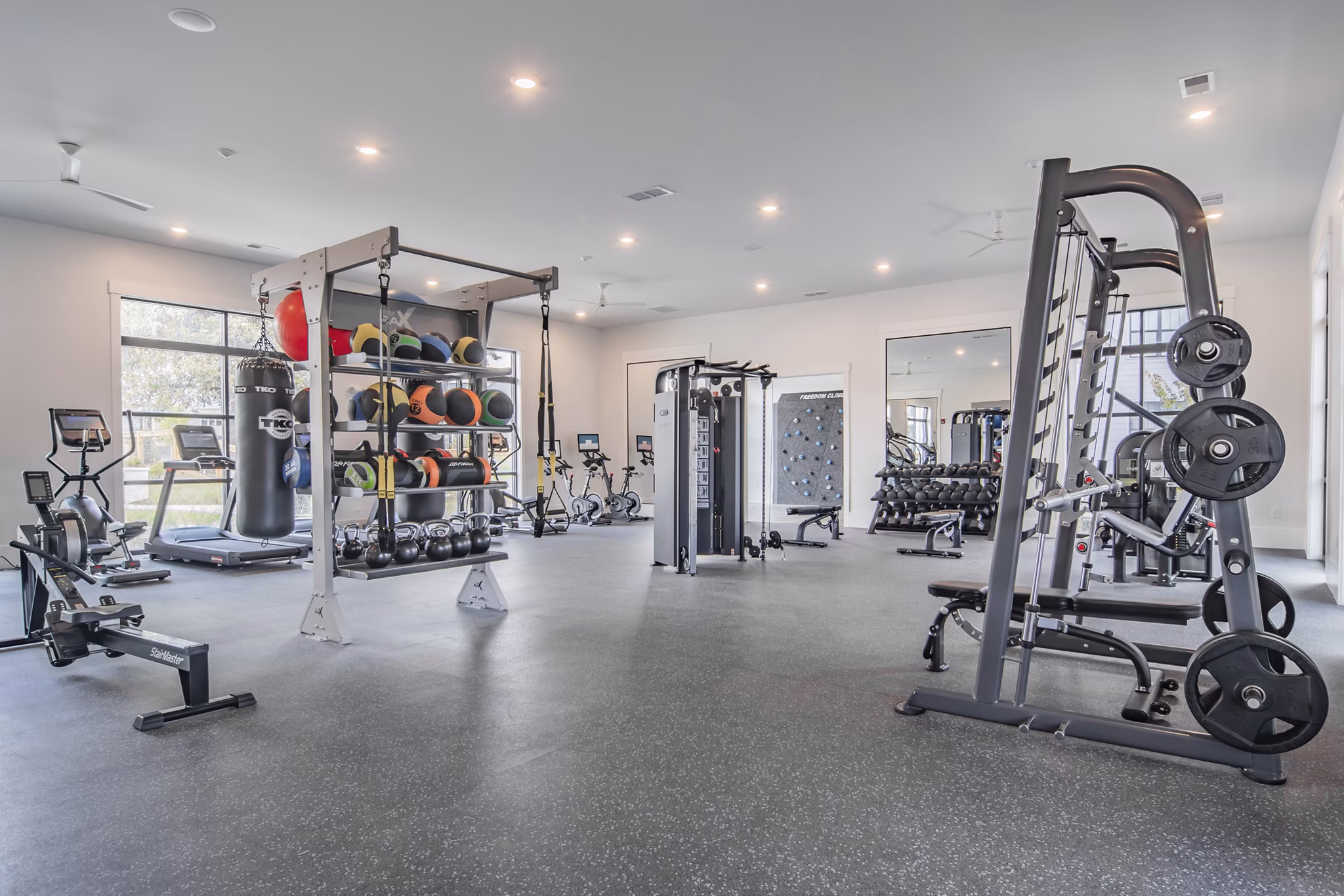 State-of-the-art fitness center at The Heron at River Island Apartments with modern equipment and spacious workout area for residents