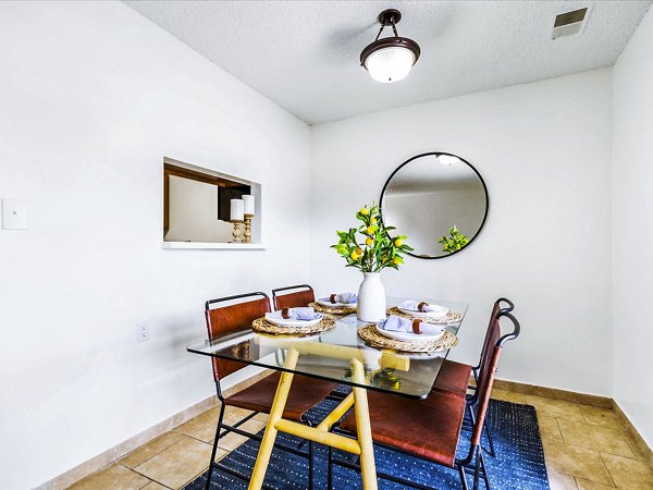 Dining room featuring modern furnishings and elegant lighting at Parc at 21st & Rock Apartments