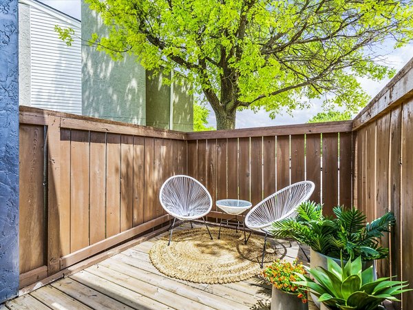 Patio with outdoor seating at Parc at 21st & Rock Apartments, offering a relaxing community space in a Greystar luxury apartment setting
