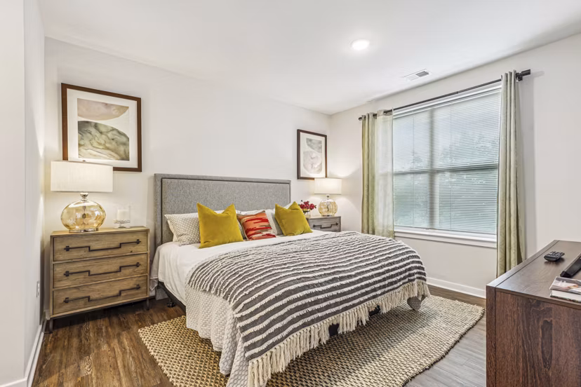 Cozy bedroom featuring modern decor at Liberty Bay Club Apartments