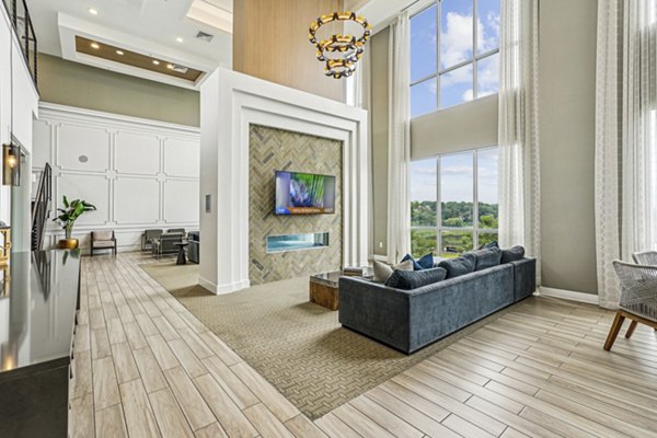 Modern clubhouse with stylish seating and open layout at Liberty Bay Club Apartments