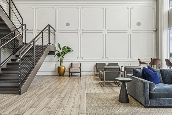 Clubhouse with modern decor and seating at Liberty Bay Club Apartments, a luxury Greystar property offering upscale community spaces