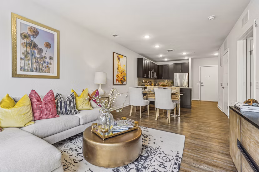 Spacious living room with modern furnishings in Liberty Bay Club Apartments