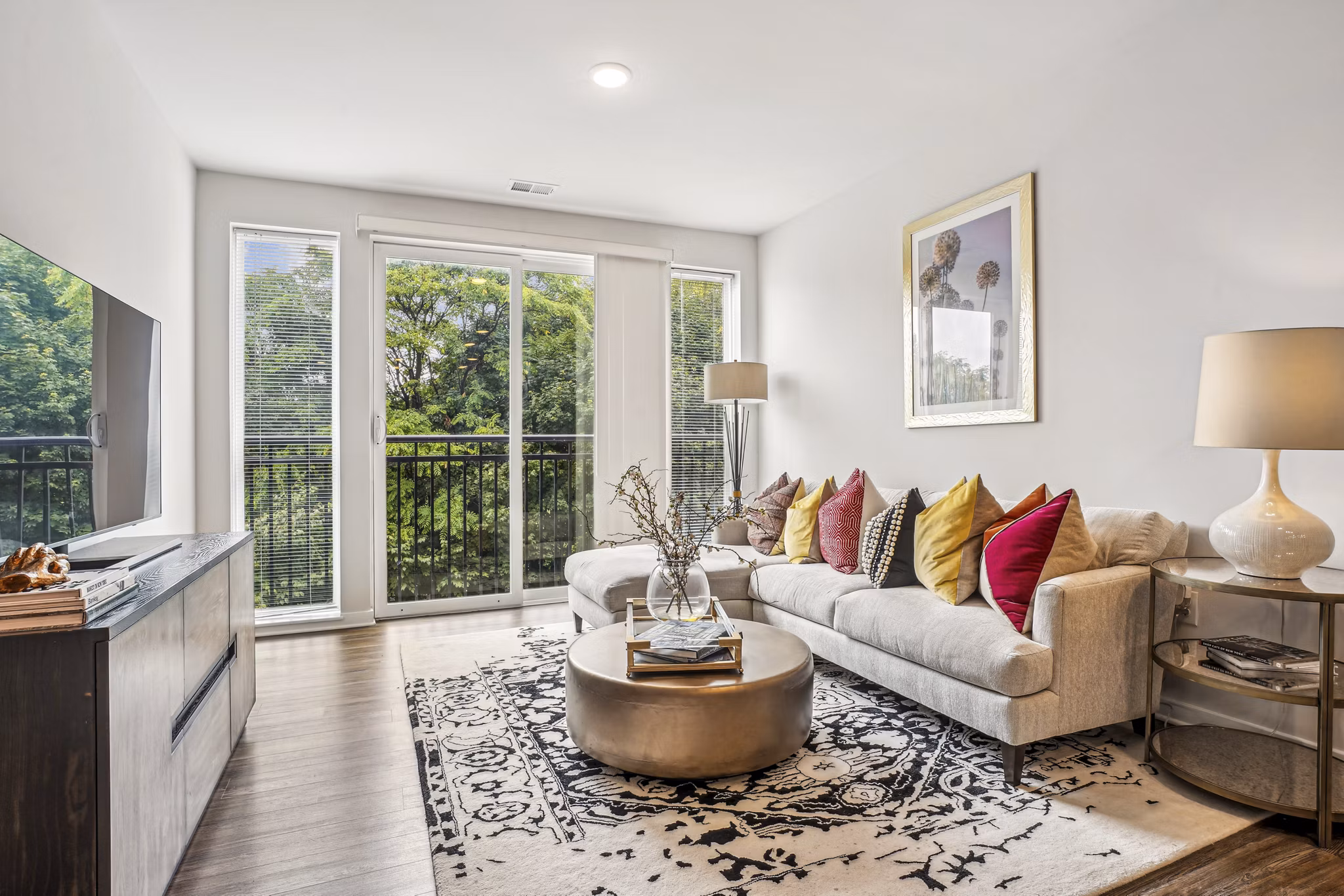Stylish living room with contemporary decor in Liberty Bay Club Apartments, offering a luxurious Greystar lifestyle