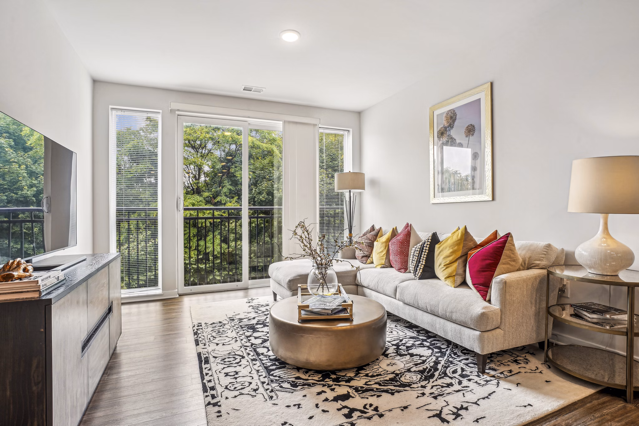 Stylish living room with contemporary decor in Liberty Bay Club Apartments, offering a luxurious Greystar lifestyle