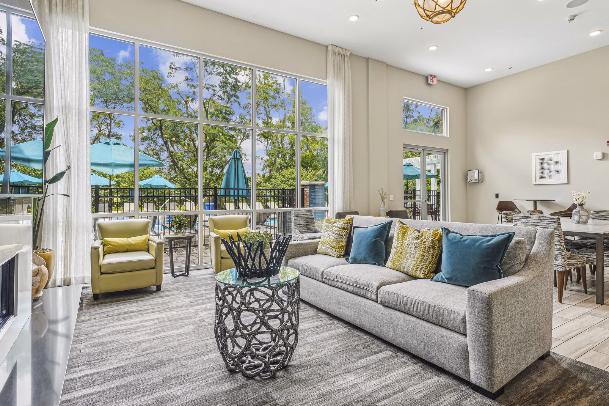 Liberty Bay Club Apartments: Modern living room with plush seating and stylish decor in luxury setting