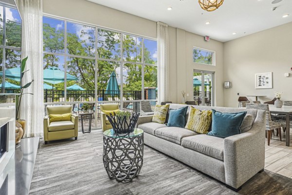Liberty Bay Club Apartments: Modern living room with plush seating and stylish decor in luxury setting